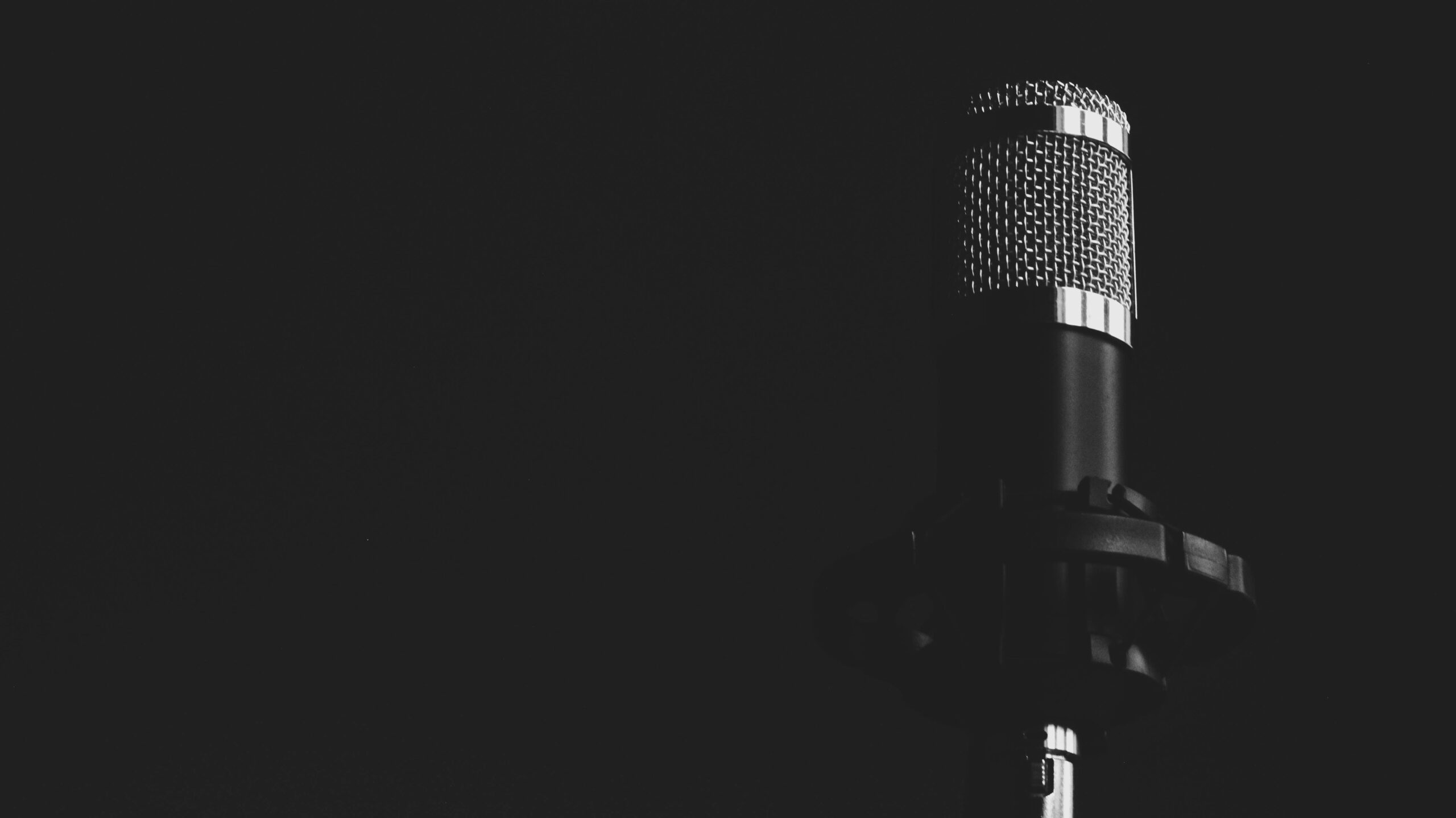 Microphone on stage in the dark.